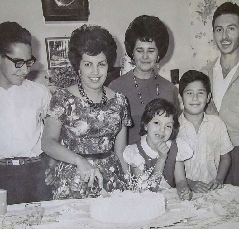 Photo of a Venezuelan family celebrating a birthday in the 1960s