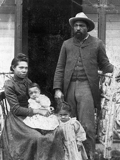 Photo of a Black family, apparently from the North American 'frontier'