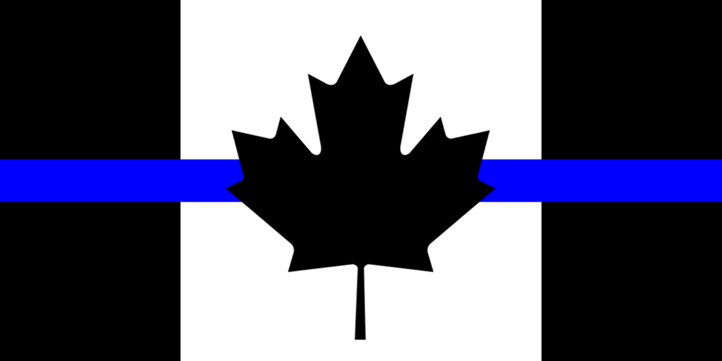 A canadian flag in black and white, with a blue line crossing horizontally across the flag behind the maple leaf