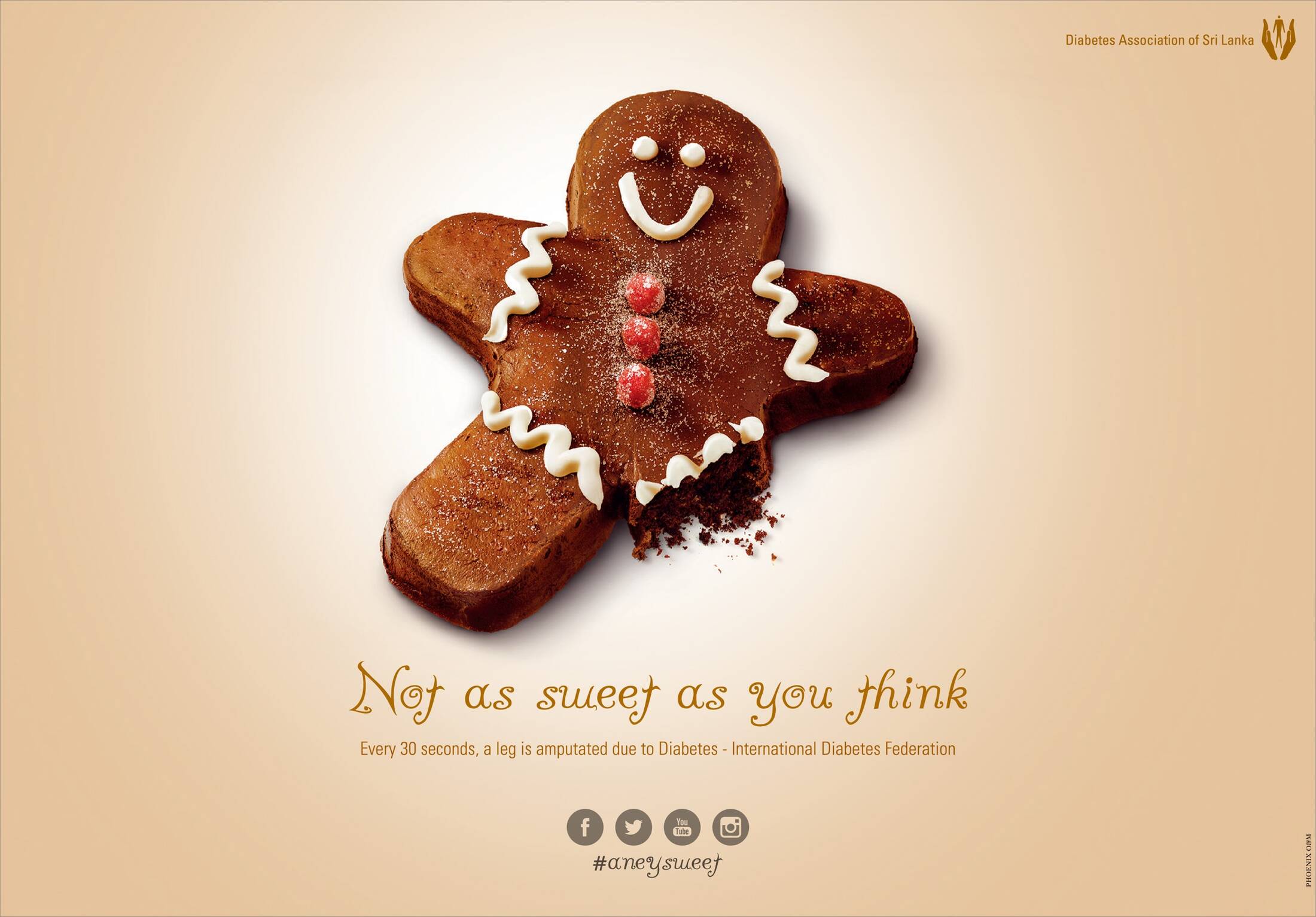 A gingerbread man cookie with one leg missing. Text underneat reads 'Not as sweet as you think. Every 30 seconds, a leg is amputated due to diabetes - International Diabetes Federation'. The ad is sponsored by the Diabetes Association of Sri Lanka