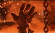 Animation of an arm descenting into a vat of molten metal. Just before it submerges completely, the hand moves to gives a thumbs-up gesture.