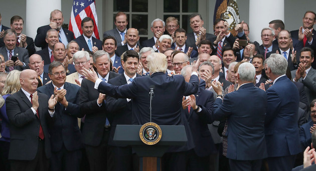 Donald Trump in front of the US White House. His back is to the camera and hi arms are stretched wide. He is facing a crowd of a few dozen prominent Republicans who are exclusively white men.